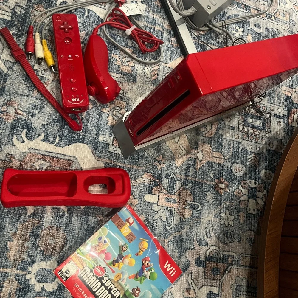 Nintendo Wii in Vibrant Red with Accessories controller. Some times. Works.